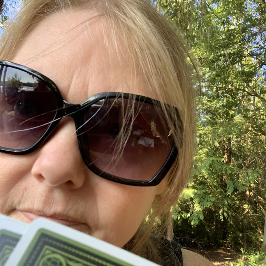 Shelley of Cowichan Digital enjoying a lakeside card game in the Cowichan Valley, representing an authentic and balanced approach to local marketing.